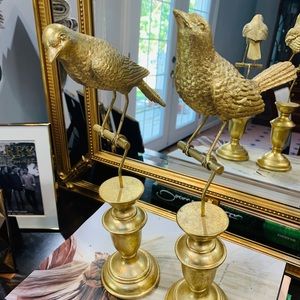 Two gold sparrow on stands